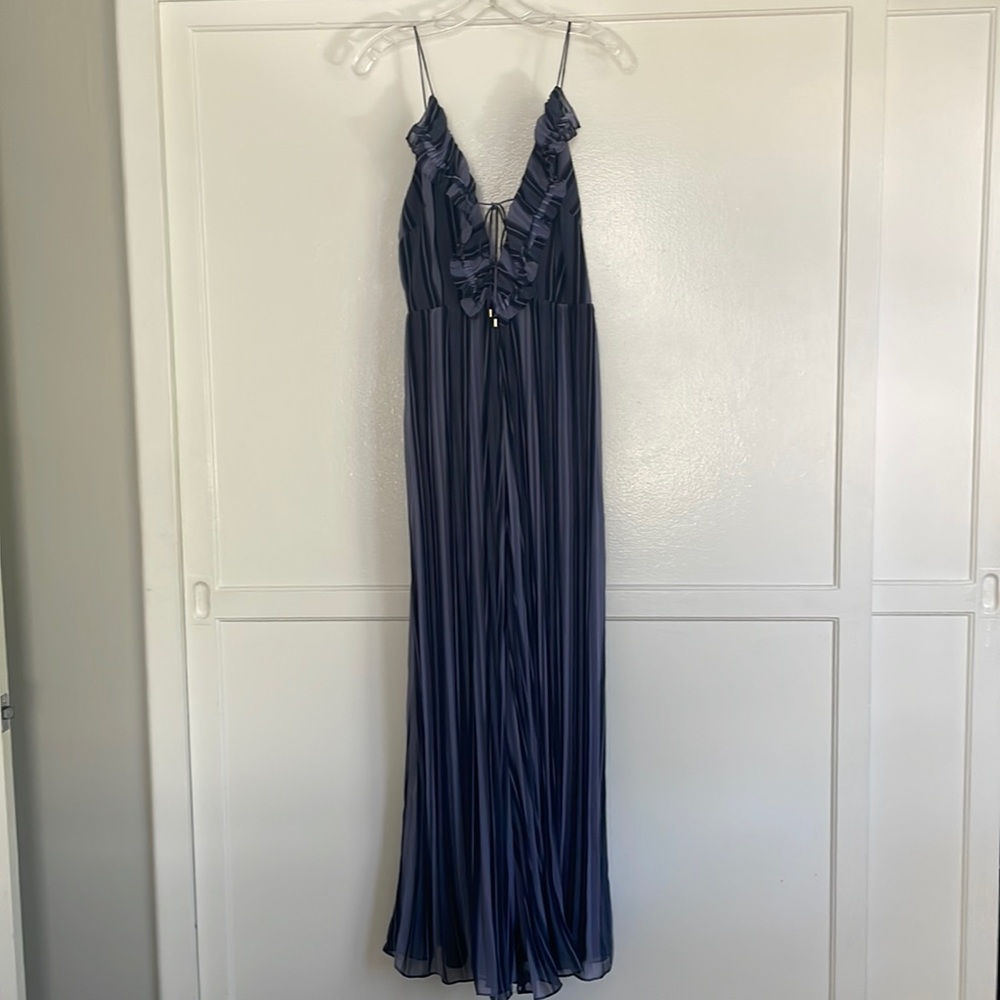 Wide leg jumpsuit w/ruffled, deep v-neckline